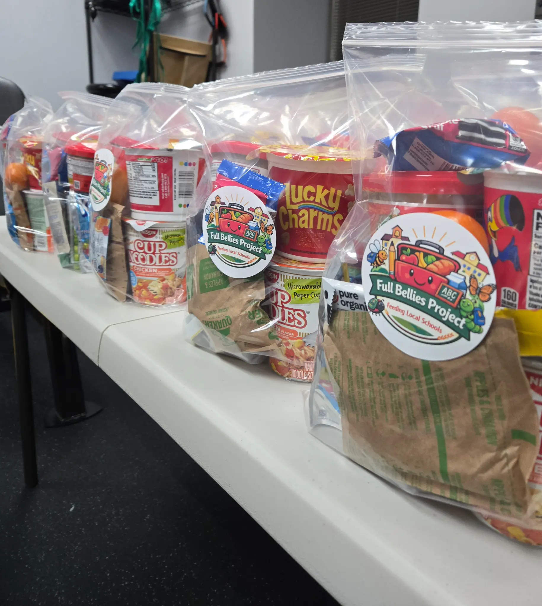 Close-up of Full Bellies Project branded food bags