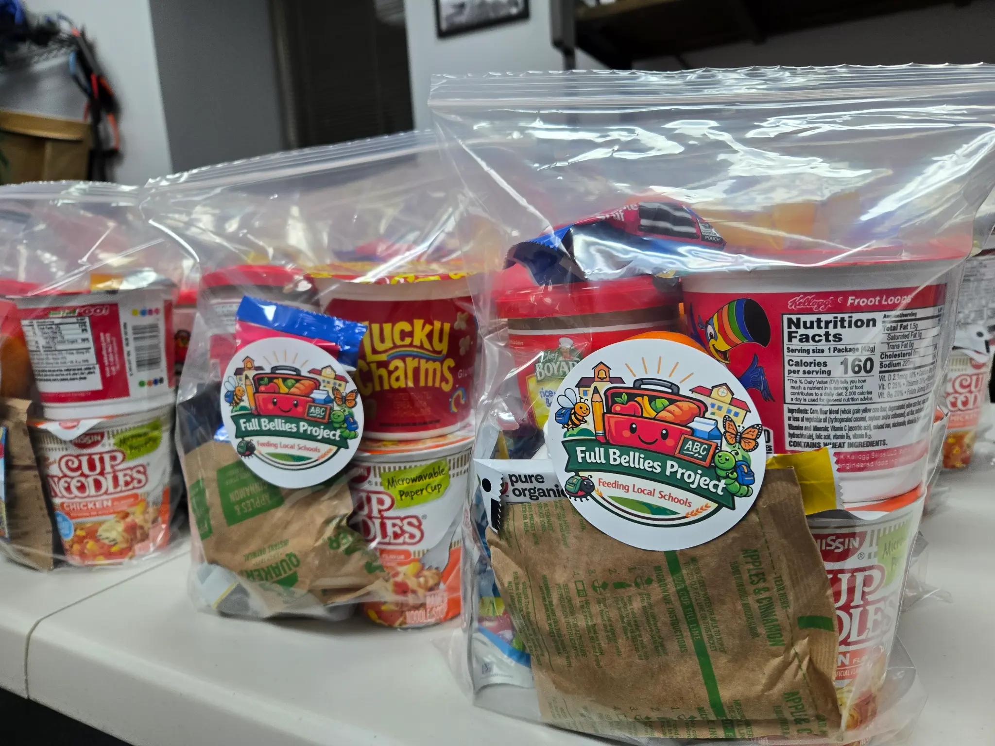 Full Bellies Project food bags lined up on a table